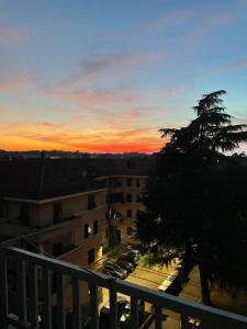 a sunset from the balcony of a building at Sabry house in Novi Ligure
