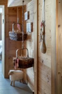 a room with a wall with baskets and spoons at Hotel Alpenfriede in Sölden +158 photos