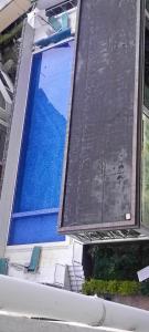 a swimming pool with blue water on a building at Hillary homes in Nairobi