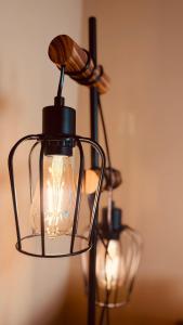 a glass lantern with a light inside of it at Fabians Ferienhaus Rursee Rusti in Simmerath