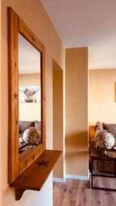 a mirror sitting on a shelf in a room at Fabians Ferienhaus Rursee Rusti in Simmerath