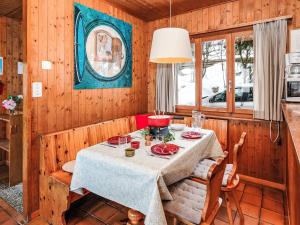 a dining room with a table in a kitchen at Chalet Sven Heul by Interhome in Nendaz