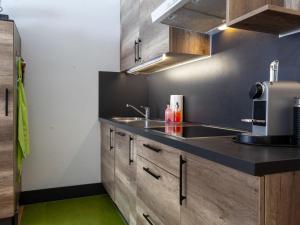 a kitchen with a sink and a counter top at Apartment Rosablanche D31 by Interhome in Siviez
