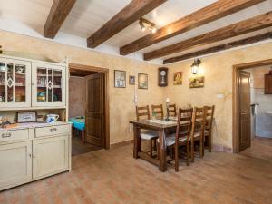 a kitchen and dining room with a table and chairs at Holiday Home Tomiceva by Interhome in Gornja Klada +43 photos