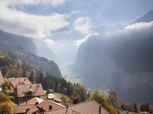 a view of a valley in the mountains with houses at Apartment Plein Soleil by Interhome in Wengen