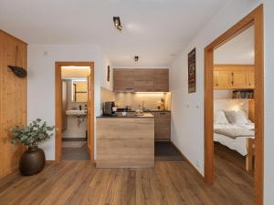 a small kitchen and bedroom in a small apartment at Apartment Baroudeur B04 by Interhome in Verbier
