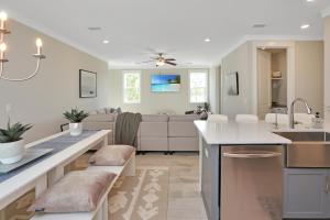 a kitchen and living room with a sink and a counter at Just Beach Baby! by Pristine Property Vacation Rentals in Cape San Blas