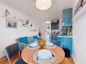 a kitchen and dining room with a table and chairs at Apartment la Pergola-2 by Interhome in Soorts-Hossegor +19 photos