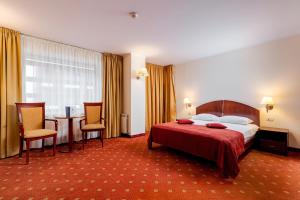 Giường trong phòng chung tại Hotel Minerva