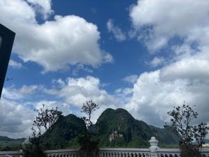 a view of some mountains under a cloudy sky at Cao Ánh Hotel in Minh Hóa