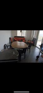 a table and chairs in a room with a table and chairs at Boca de viento Chica in Chicá