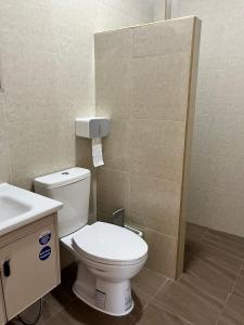 a bathroom with a white toilet and a sink at Sukhothai Indy Resort in Sukhothai +77 photos