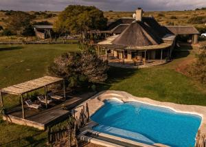 an aerial view of a house with a swimming pool at Hlosi Game Lodge - Amakhala Game Reserve in Amakhala Game Reserve