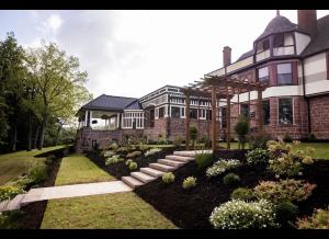 a large house with a garden in front of it at Alden Villa in Lebanon
