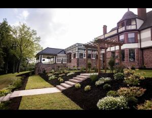 a large house with a garden in front of it at Alden Villa in Lebanon +18 photos