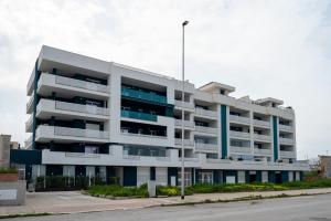 an apartment building on the corner of a street at Ad un passo dal mare apartment in Molfetta
