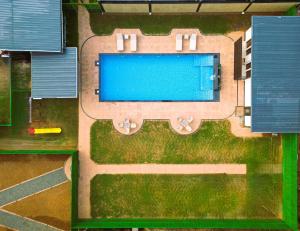 an overhead view of a swimming pool in a yard at B Town Resort Near Infopark Kakkanad in Kakkanad