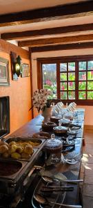a buffet line with many different types of food at Pousada dos Veleiros in Nova Almeida