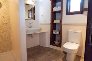 a bathroom with a toilet and a sink at Elegant-Lindian Villa Marietta in Lindos