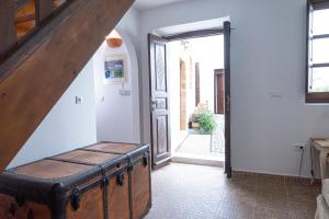 a room with an open door with a suitcase in it at Elegant-Lindian Villa Marietta in Lindos
