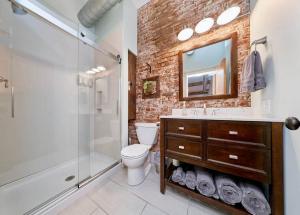 a bathroom with a sink toilet and a shower at Studio 1892 Guesthouse in Hermann
