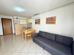 a living room with a couch and a table at Alessia in Grado