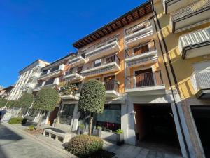a large building with trees in front of it at Alessia in Grado