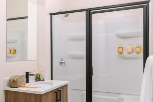 a bathroom with a shower and a sink at LIVN Millennium Park Downtown Chicago Superior 1BR in Chicago