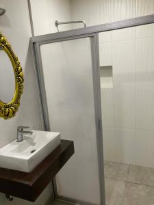 a bathroom with a sink and a mirror at Departamentos frente a Chedraui in Tuxtla Gutiérrez +25 photos