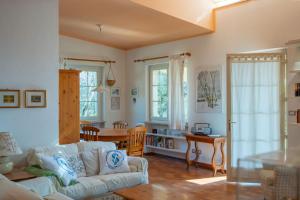 a living room with a couch and a table at Villa Panorama in Bardolino
