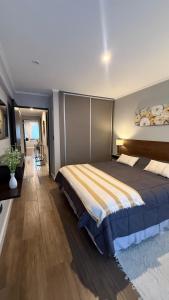 a bedroom with a large bed in a room at Ballester's Dream in San Martín de los Andes +56 photos