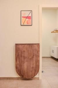 a wooden object sitting on a wall in a room at City Centre Gem - Machne Yehuda in Jerusalem