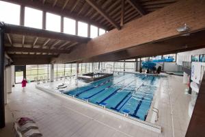 an overhead view of a large swimming pool at Isolden Green Srl Berlanda Mountain suites in Cavalese