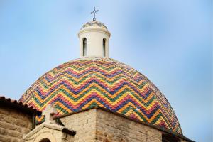 a colorful dome on top of a building at Vicino Aeroporto - Orange Marina Room in Olbia