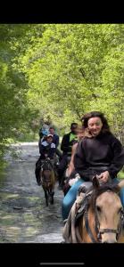 a group of people riding horses down a path at Ardoti Guest House in Ardoti