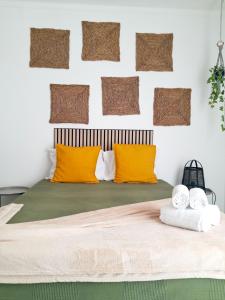a bedroom with a bed with orange pillows at Easy4Stay in Portimão +160 photos
