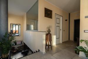 a hallway of a home with a stairway at La reggia di Gianfry in Fermo
