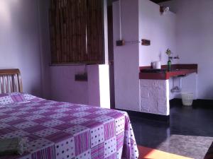Postel nebo postele na pokoji v ubytování Adams Wood House Ayurveda Homestay Kochi