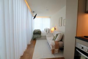a living room with white curtains and a couch at VILLA La Finca - Privada in Vieira do Minho +48 photos