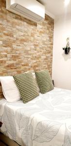 a bedroom with a bed with two pillows on it at Easy4Stay in Portimão