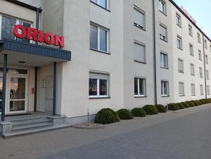a building with a sign on the front of it at ORION in Ostrów Mazowiecka