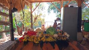 a bunch of bananas and other fruits on a table at Patziapa in Santiago Atitlán +9 photos