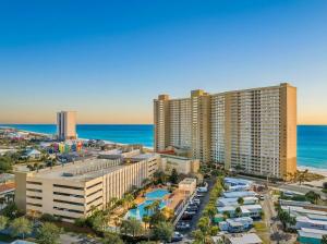 an aerial view of a city with buildings and the ocean at Goin Coastal Emerald Beach Unit 729 in Panama City Beach