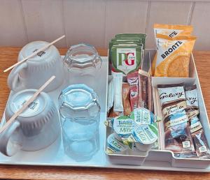 a tray with food and other items on a table at Brig O'Doon Guest House in Edinburgh