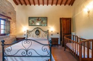 a bedroom with a bed in a room with a staircase at Villa Badia, large villa in Umbria with private pool in Città di Castello +35 photos