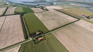 an aerial view of a field with fields and trees at Casa Adami Due in Brussa +11 photos