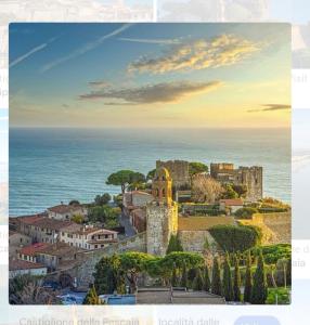 a view of a town with a castle and the ocean at Appartamento la Speranza in Grosseto