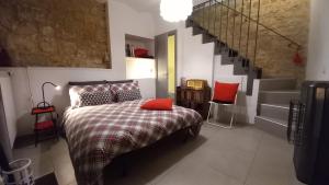 Un pat sau paturi într-o cameră la Casa Vincenti +20 fotografii