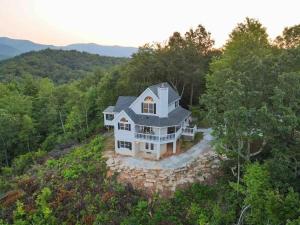 an aerial view of a house in the woods at Sky Harbour in Andrews