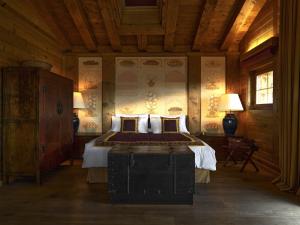 a bedroom with a bed in a wooden room at LeCrans in Crans-Montana +208 photos